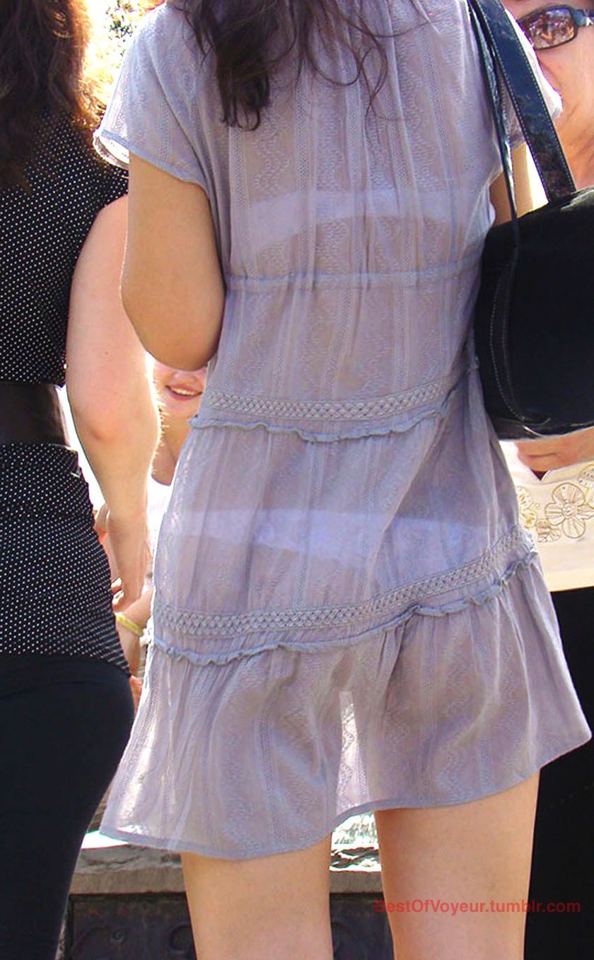 bestofvoyeur:  Girl in semi transparent dress in the streets let us see her ass in