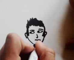 juicybbieber:  Justin Bieber drawing a self portrait  