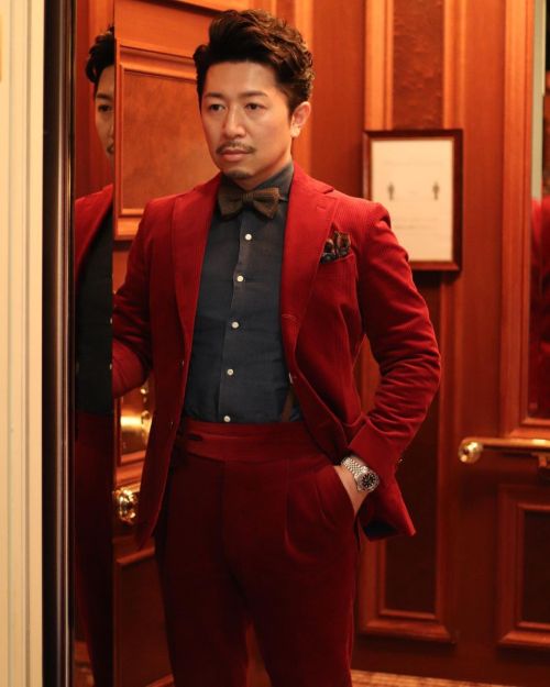 Styling in a red suit…” —————————