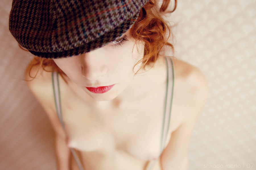 fireredgirls:  Cute little breasts on this sexy redhead with suspenders.