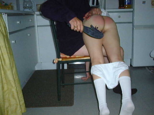 I like that he’s not wearing pants - which means she can feel his cock getting harder, AND means that when her bottom is nice and hot and sore, he’ll be fucking her silly.