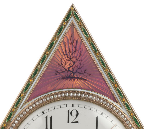 The Tsarina's Fabergé Clock, triangular, gold centred by a white enamel dial, with Arabic chapters a