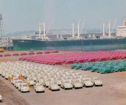 vlugs:  Shipment of Volkswagen Beetles parked by color at the port of Portland, 1965.