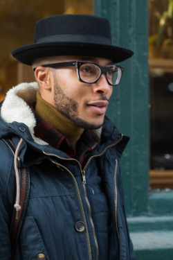 details:  The bespectacled city slicker shows