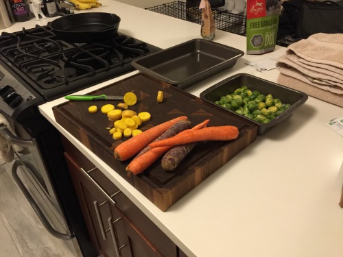 crispy salmon with roasted brussels sprouts and crispy garlic heirloom carrots