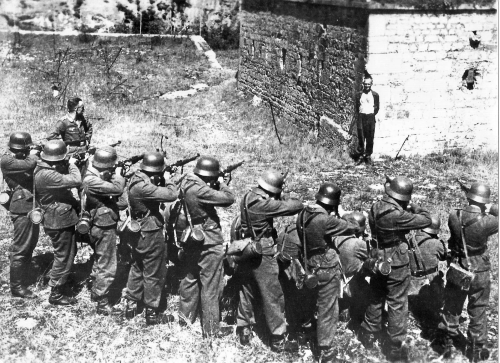 tkohl:  Georges Blind, a Member of the French Resistance, Smiling at a German Firing Squad, October 1944