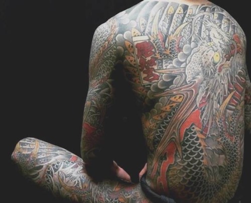 Beautiful dragon tattoo. Unfortunately cannot read the artist’s signature. Anyone can help?:) 