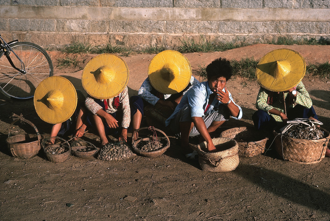 dolm:    China. Hui'an. Fujian. 1983. Hui’an women wear yellow hats and shirts