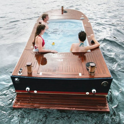 awesomeshityoucanbuy:Electric Hot Tub BoatHot tub boats are all the rage these days, but now you can relax on the high seas and go green at the same time with this electric hot tub boat. Featuring handcrafted African teak on the deck, the hot tub boat