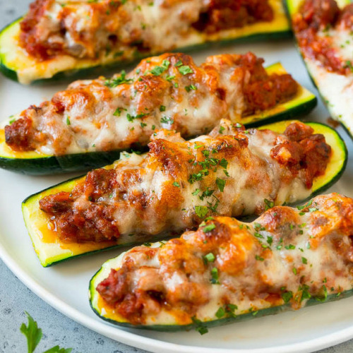 foodffs:These stuffed zucchini boats are filled with a hearty sausage mixture, then topped with plen