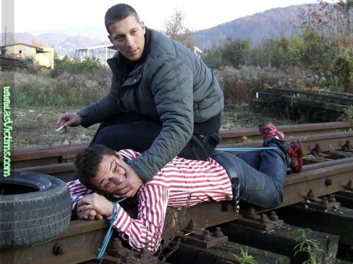 asvictims: Handgagged on the rails - enjoy my Dom / sub pic from http://www.asVictims.com 