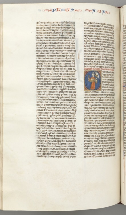 cma-medieval-art: Fol. 361v, Habbakuk, historiated initial O, Habbakuk holding a basket and two ston