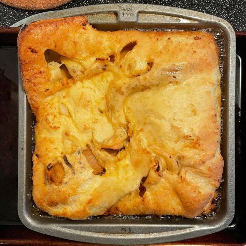 Vegetarian “toad in the hole,” with @beyondmeat , #onion , and #yorkshirepudding - greasy (in a grea