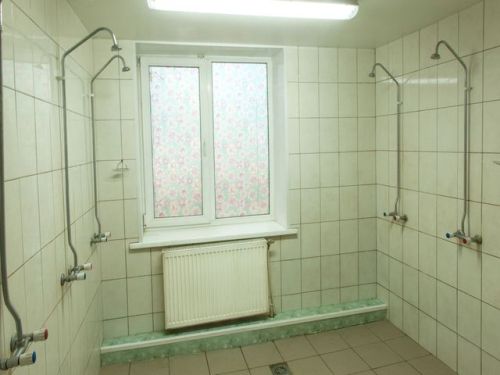 Shower room of a worker’s hostel in Alabino, Moscow Oblast, Russia. This type of accommodation is of