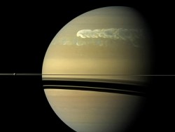 science-junkie:  Saturn’s ‘great white spots’ linked to water About once every Saturn year—29.5 of our years—a mysterious great white  spot erupts in the planet’s atmosphere that can outshine the planet’s  brilliant rings. This image shows