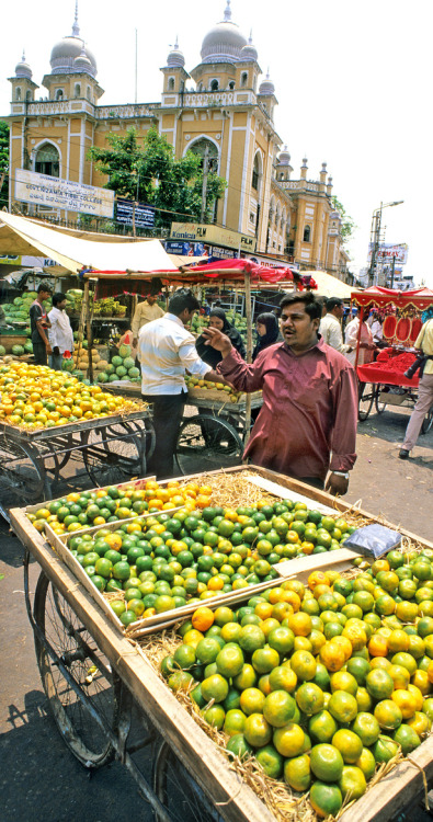 Mosambi vendors near the Charminar in Hyderabad, India. Photo by David May.