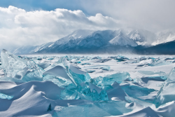 nubbsgalore:  russia’s lake baikal, the world’s oldest, largest and deepest freshwater lake, freezes over for half the year, creating the clear, turquoise ice seen in these photos by (click pic) alexey kharitonov, alexey trofimov, santorifoto, valery