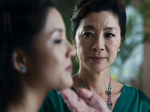 A gif from Crazy Rich Asians where Michelle Yeoh looks displeased with Constance Wu.