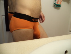 bikinithonglover:  Agacio brief. Used some orange dye on this one  Damn! You’re about to burst out of this pair 😍