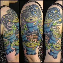 fuckyeahtattoos:  My Toy Story alien half sleeve.By Daniel Morris @ Rain City, Manchester, UK. 