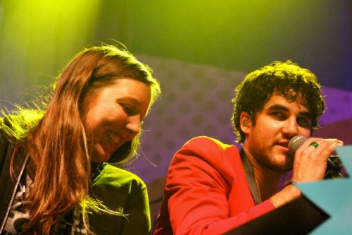 Darren Criss with a fan on stage in concert at The Fillmore in San Francisco, CA