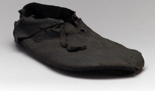 Shoes, 16th century English Black leather These glorious pieces of footwear excavated from an archae