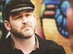 bearchaser:  let me try to sum up why this face is classily handsome and damn near perfect (for me): the full beard, the wide, chiseled jaw, the slightly pudgy tip of the nose, and perhaps most important, the downturned shape of the eyes that give him