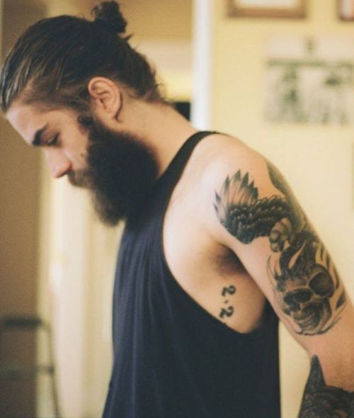 beardsplustattoos:  Man buns,yup.  Sexy lad.