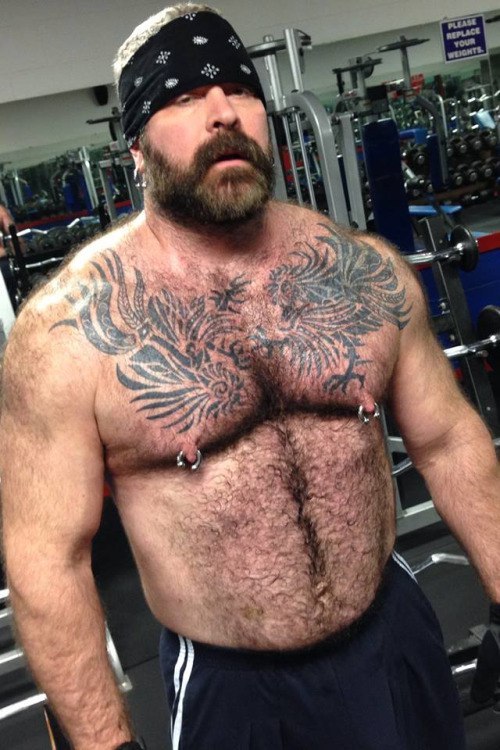 Sexy looking man, with great looking ink work, great looking pecs and awesome pierced