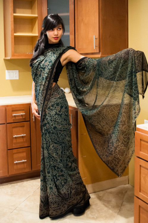 designedtoseduce:  zessinna-saris:  Dark green georgette fabric with the white and yellow design throughout the sari. It’s absolutely beautiful, and perfect for a night out or any event. Maybe even try it with a corset! A dull yellow, or silver corset,