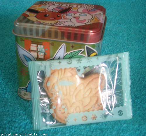 guys look, i finally got a thing i’ve been searching for for months now, this Sylveon cookie tin ! And it has a Sylveon head shaped sugar cookie in it too !! So cute     