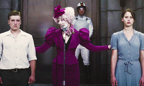  I think the biggest contrast here is Effie. Katniss and Peeta are about to relive the events they barely survived, again but here you can really see that Effie is concerned, worried and somewhat distraught, compared to the first picture. I can really