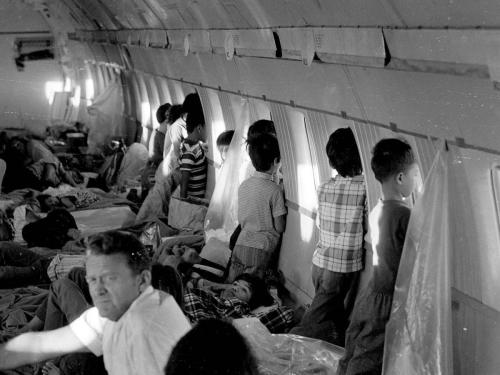 Orphans Aboard The First Operation Babylift Flight At The End Of The Vietnam War Look Out Of The Windows