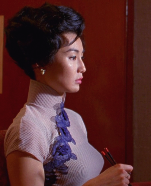 hoanbee:  Maggie Cheung wears a different cheongsam (qipao) dress in each scene of Wong Kar-Wai’s In the Mood For Love. There were 46 in all, though not all made it to the final cut. 