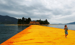 psl:  archatlas:  Walking on Water Christo’s ‘Floating Piers’ installation finally opens to the public June 18th.    The highly-anticipated reveal sees 100,000 square meters of shimmering yellow fabric wrap a floating dock that connects various