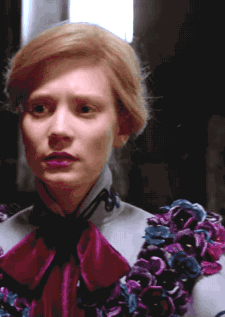 awkward-sultana:Crimson Peak (2015) + Edith Cushing’s grey coat with black embroidery and purple flo
