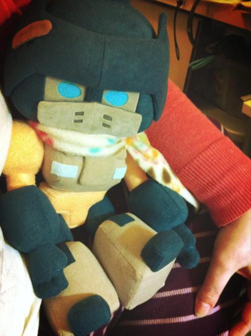 sowiddlefur:  Oh, I never posted the plushie Ironfist I made myself here. I have a plushie family of 3. :D Ironfist has a hole in his helm and Drift made him a special band-aid to cover the hole… Yes, I was super sad he died in the comics and I adore