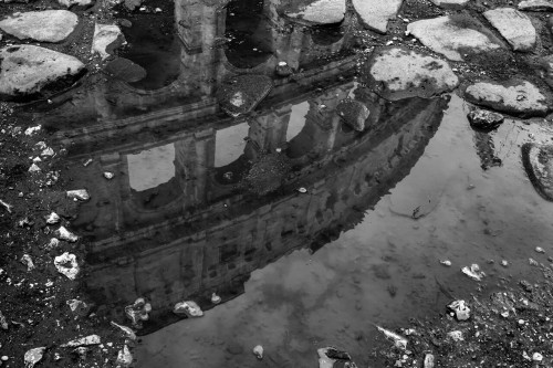 “Some people feel the rain. Others get wet.”  Roma, Italy.  Photo by Matt Blum.