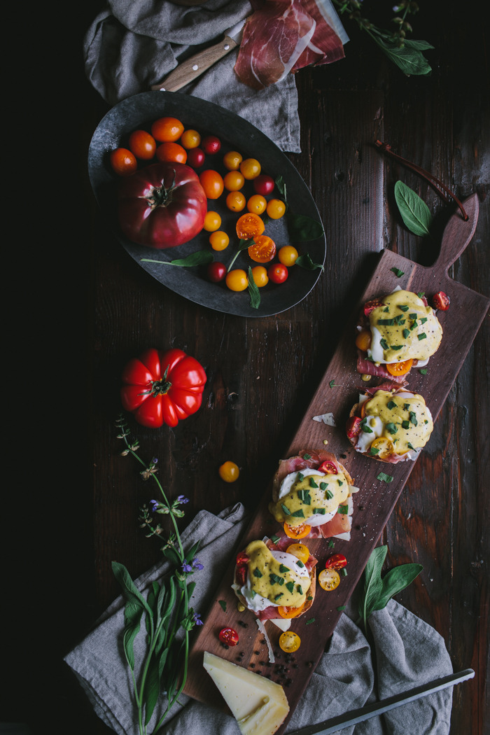 gastronomicgoodies:Eggs Benedict with Manchego, Tomatoes, Prosciutto and a Sage Hollandaise