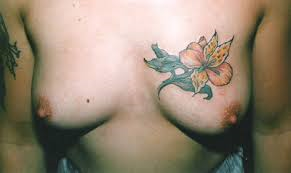 falling-angel26:  Boobs and tattoo’s all the way :3