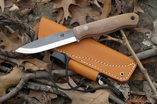 sakitup:  Koster bush craft knife with leather sheath, firesteel loop and Light My Fire Army firesteel.