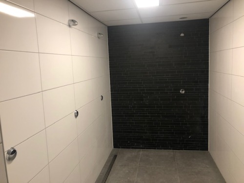 Locker room showers at a gym called Train4Less in Schagen, the Netherlands.