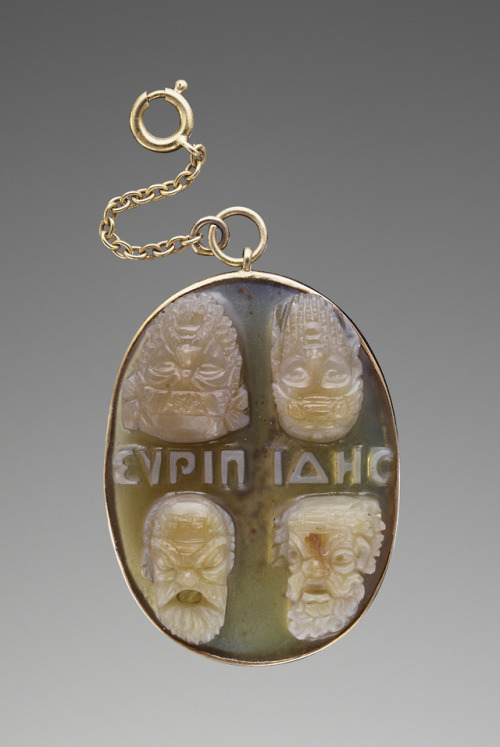 didoofcarthage:Ancient cameo in modern mount, with two pairs of theatrical masks and an inscription 