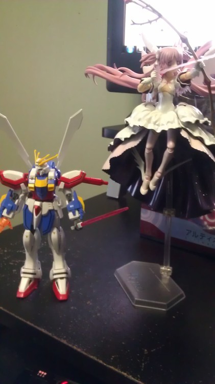 0lightsource said: Oh hey!! I wanted to get this Madoka figure actually xD How big is she? Like a Gundam l44 scale or smaller? Bigger? lol lol I just happen to have a 144 scale God Gundam to compare her to.  I couldn’t take her down since it