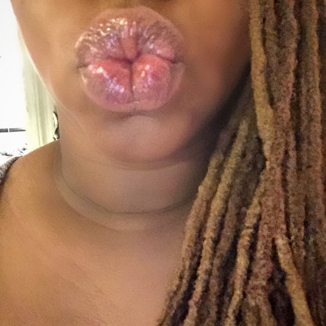 missprimproper:  A very shiny, lip glossy kiss to you all. Happy New Year!