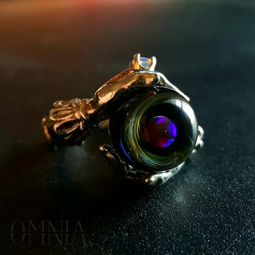 Oracle ring in polished sterling silver, set with a beautiful handmade glass orb containing a black 