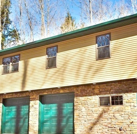 Exterior SidingAn Illustration Of A Medium-sized One-story, Brown, Mixed-siding Exterior Home Design