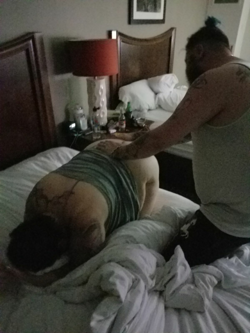 glitterdustedbitch:  Getting a good spanking from @punishedtattooedprincess and @thebeard81. Getting me nice and wet for daddy to fuck. @biggdaddy73
