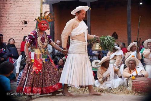 Priest and masked dancer during festivity in Nepal, photo by Govinda Maharjan