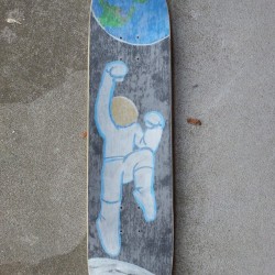 Skateboard deck top with clear grip tape.